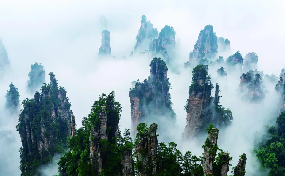 Wulingyuan peaks rising through mist